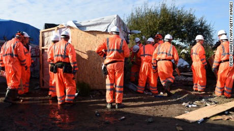 Workers begin the demolition of the Calais &quot;Jungle&quot; camp on Tuesday.
