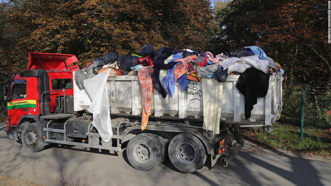 Migrants&#39; belongings are trucked out of the &quot;Jungle&quot; on October 25.