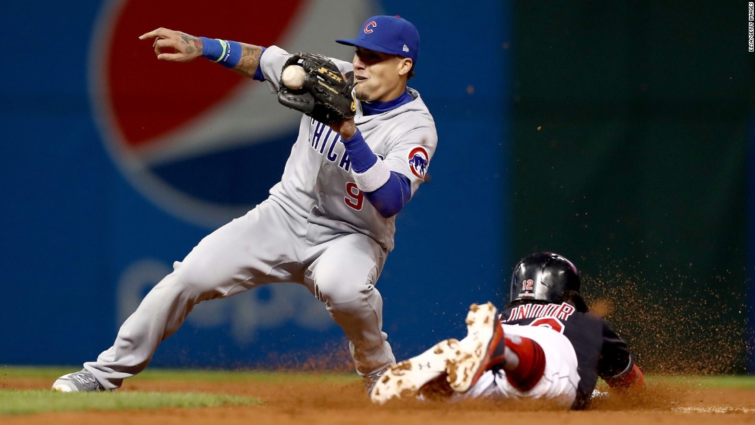 Javier Baez of the Cubs tags out Cleveland&#39;s Francisco Lindor as he tries to steal second base in Game 1.