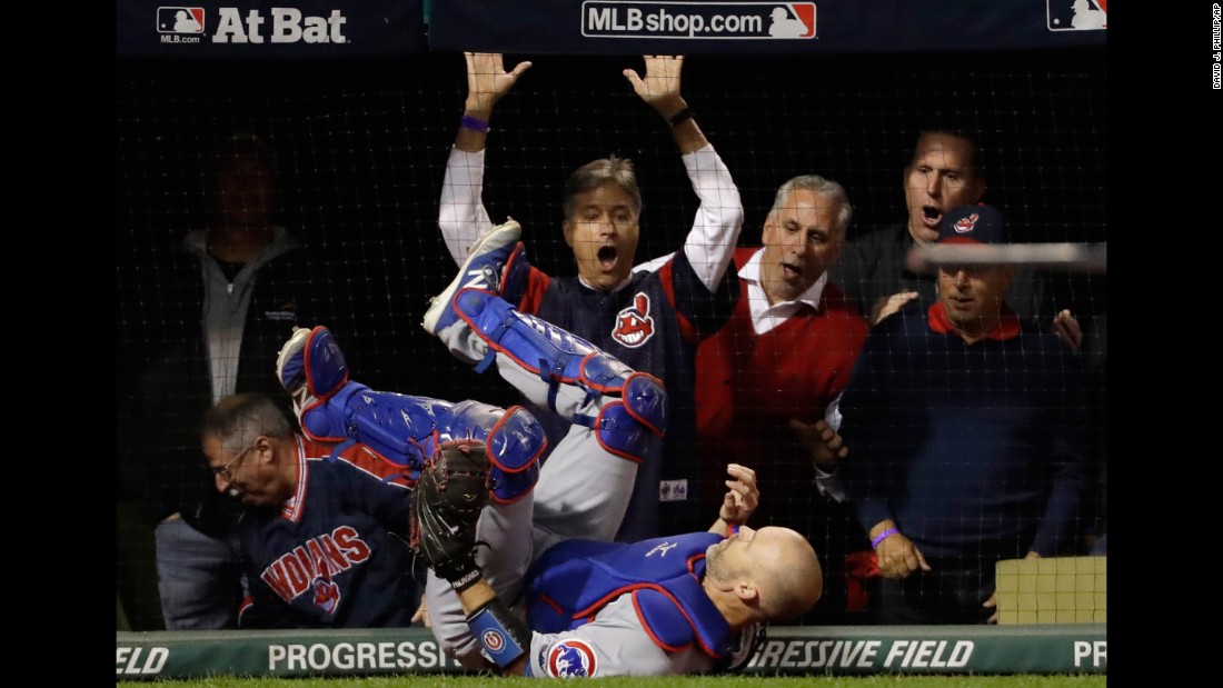 Cubs catcher David Ross falls after catching a pop fly by Cleveland&#39;s Lonnie Chisenhall in Game 1.