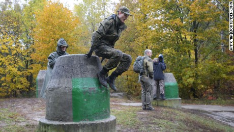 Recruits run through a training course near Warsaw.