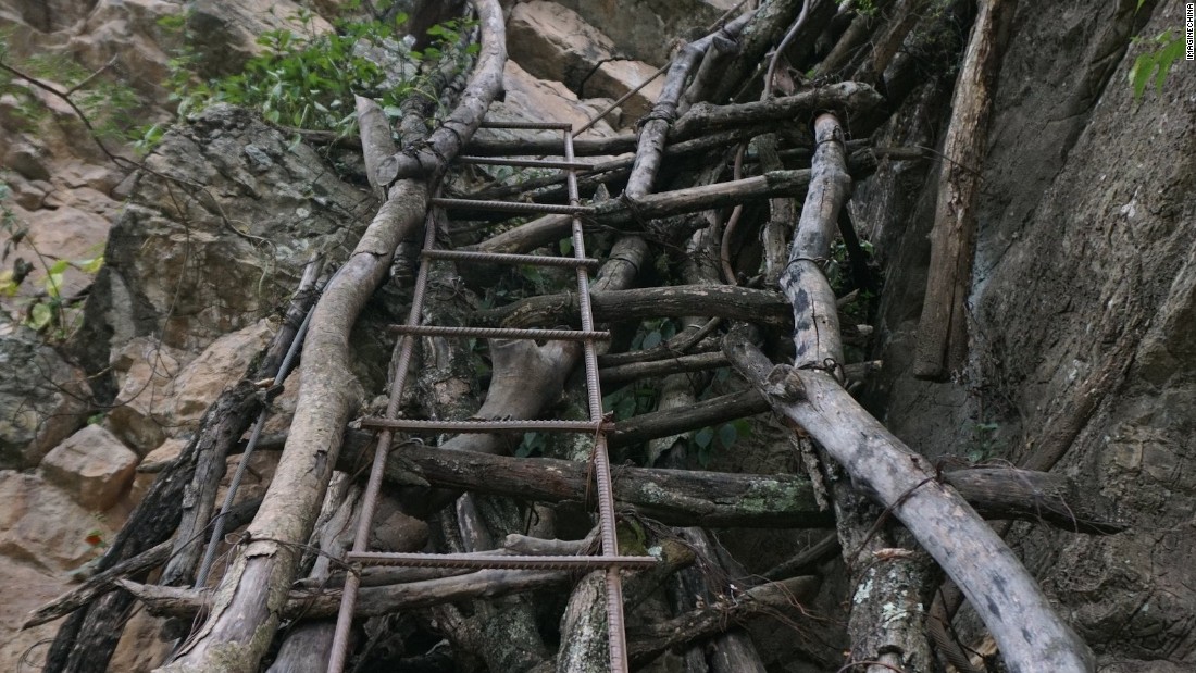 School children had been forced to use unsteady vine ladders to reach their boarding school in the valley below. 