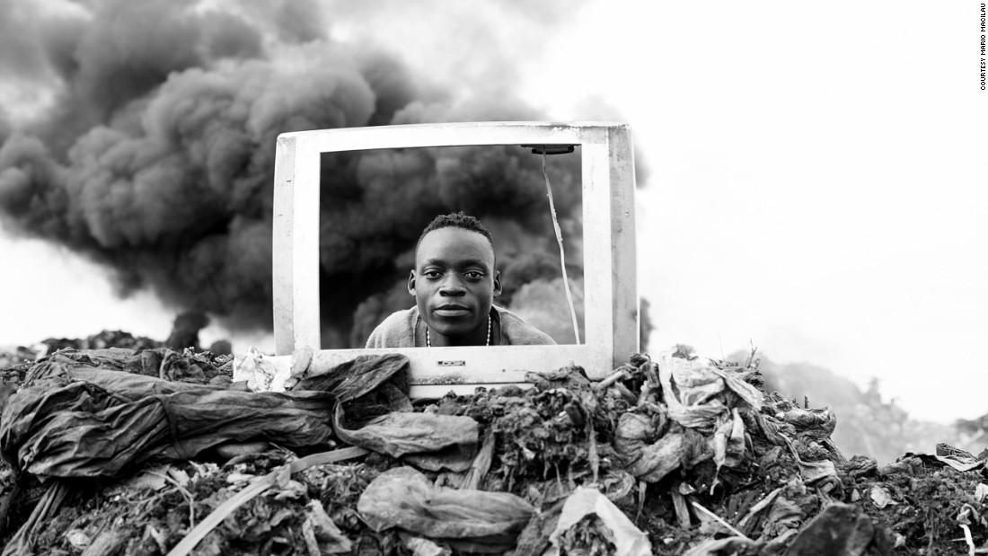 A boy plays behind a discarded TV frame. Electronic waste is burned at the site, explains Macilau, releasing hazardous chemicals into the environment. 