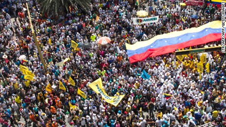 People protest against the government of Venezuelan President Nicolas Maduro in Porlamar, Margarita Island on October 26, 2016. 
Venezuela's opposition ratcheted up the pressure on President Nicolas Maduro at mass protests, announcing plans for a general strike, a new march and a legislative onslaught. More than 20 people were injured and 39 were detained at anti-government protests, the head of a local rights group said.





 / AFP / STR        (Photo credit should read STR/AFP/Getty Images)