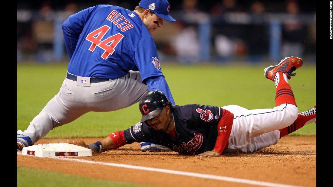 Francisco Lindor of the Indians dives back to first on an attempted pick-off in Game 2.