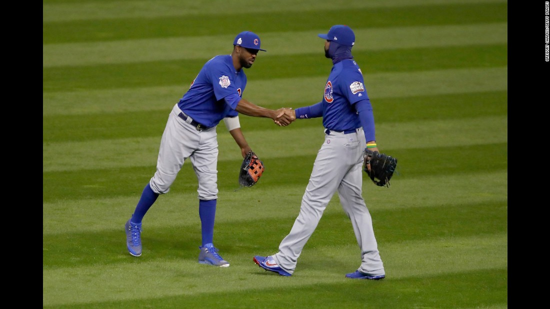 Dexter Fowler of the Cubs celebrates with Jason Heyward after defeating the Indians 5-1 in Game 2.