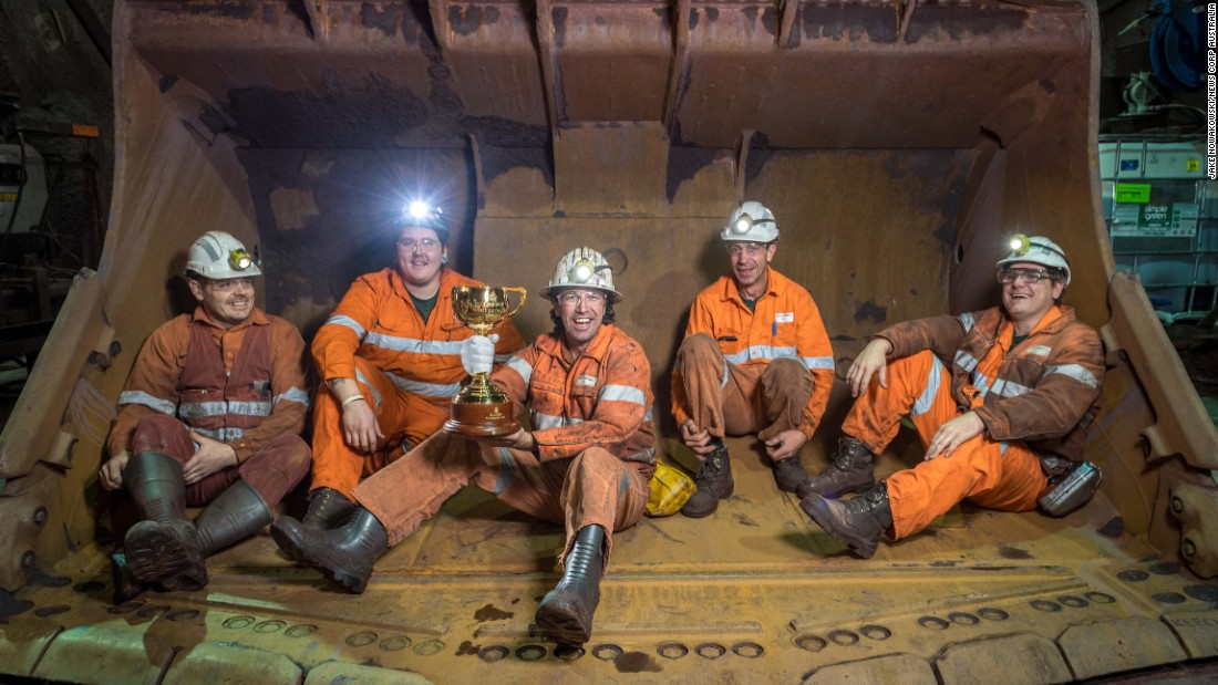 Brian Connelly, Mick Williams, Nigel Shinnick, Angelo Dal Carrobbo and James Hooper pose with the trophy at BHP Billiton&#39;s Olympic Dam copper, gold and uranium mine in Roxby Downs, South Australia. 