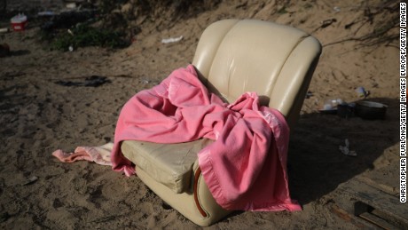 A leather armchair -- too big to carry -- with a blanket.