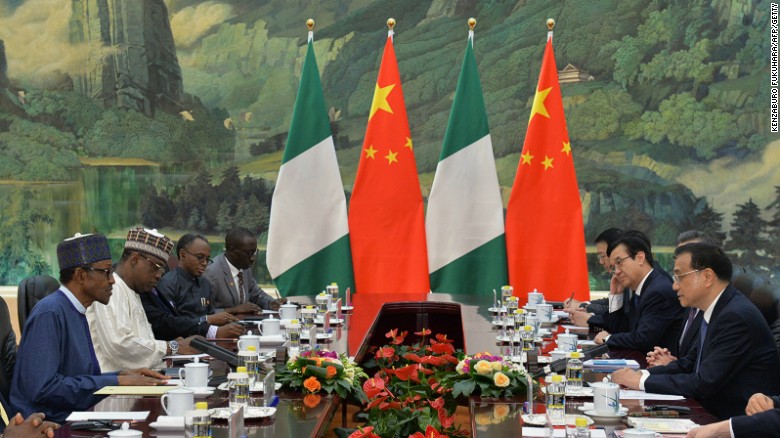 Nigerian President Muhammadu Buhari has dinner with Chinese Premier Li Keqiang in Beijing in April 2016.