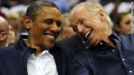 WASHINGTON, DC - JULY 16: U.S. President Barack Obama and Vice President Joe Biden share a laugh as the US Senior Men&#39;s National Team and Brazil play during a pre-Olympic exhibition basketball game at the Verizon Center on July 16, 2012 in Washington, DC. (Photo by Patrick Smith/Getty Images)