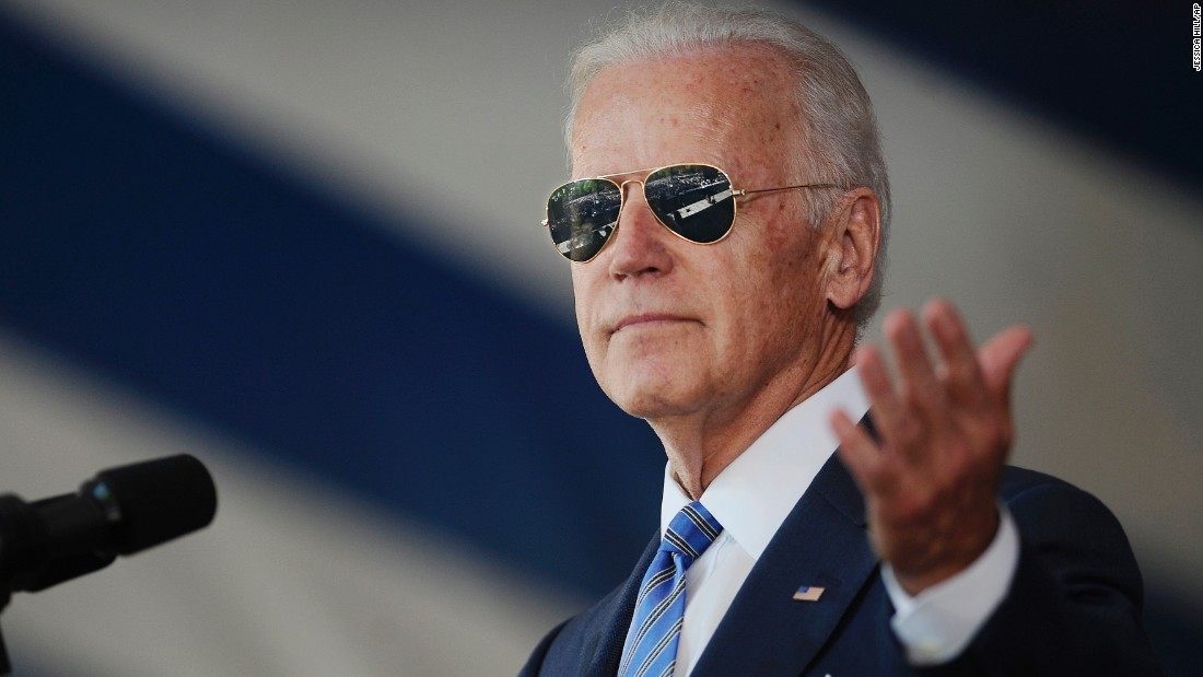 Biden wears &lt;a href=&quot;http://www.cnn.com/2014/04/16/politics/gallery/joe-biden-on-instagram/index.html&quot; target=&quot;_blank&quot;&gt;his signature aviator sunglasses&lt;/a&gt; as he addresses graduating students at Yale University in May 2015.