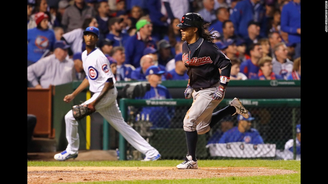 Michael Martinez of the Cleveland Indians scores a run during the seventh inning in Game 3.