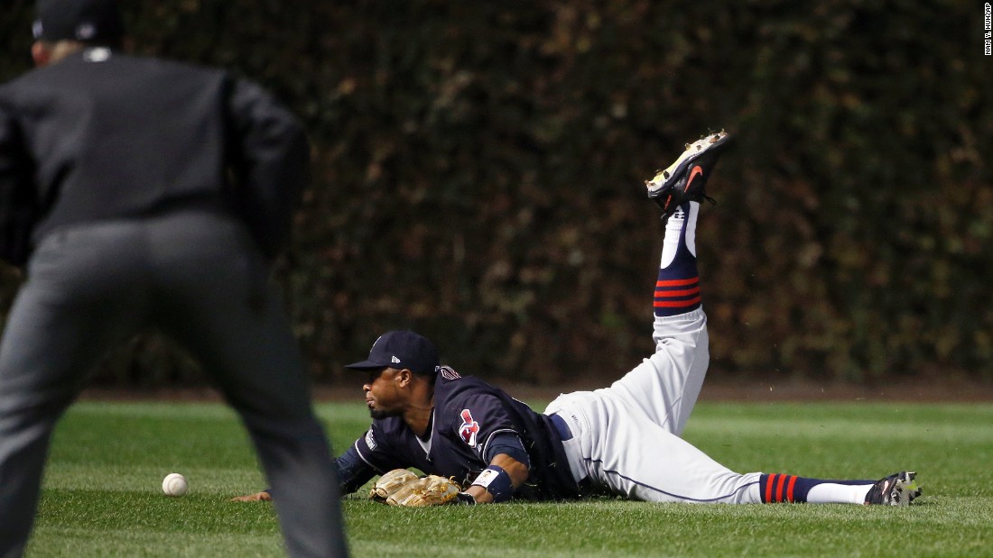Indians center fielder Rajai Davis can&#39;t catch the ball hit by Chicago Cubs&#39; Dexter Fowler during the first inning of Game 4.