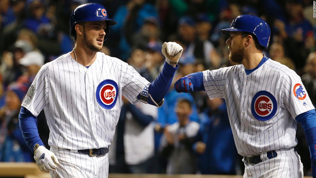 The Cubs&#39; Kris Bryant, left, celebrates with Ben Zobrist after hitting a home run during the fourth inning of Game 5.