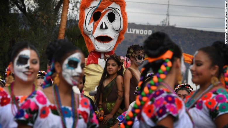 People in costume gather for the annual Dia de los Muertos, or Day of the Dead, festival at the Hollywood Forever cemetery in Hollywood, California, on October 29, 2016. Dia de los Muertos is a festival to remember friends and family members who have died and originated in Mexico.
