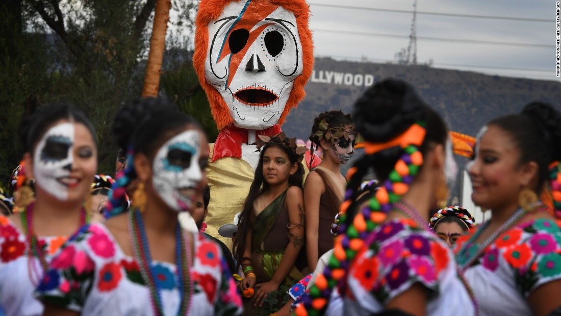 People in costume gather for the annual Dia de los Muertos, or Day of the Dead, festival at the Hollywood Forever cemetery in Hollywood, California, on October 29, 2016. Dia de los Muertos is a festival to remember friends and family members who have died and originated in Mexico.
