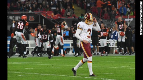 Washington Redskins placekicker Dustin Hopkins reacts after missing a 34-yard field goal in overtime against the Cincinnati Bengals at Wembley Stadium in London. The Redskins and Bengals tied 27-27.
