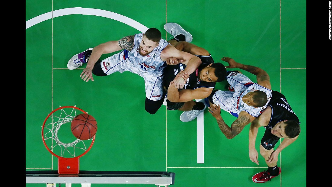 Players from the New Zealand Breakers and the Adelaide 36ers try to box each other out during an NBL game in Auckland, New Zealand, on Friday, October 29.
