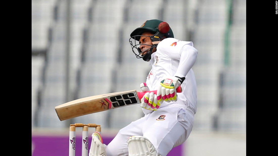 The ball hits the helmet of Bangladesh captain Mushfiqur Rahim as he bats against England in Dhaka, Bangladesh, on Friday, October 28.