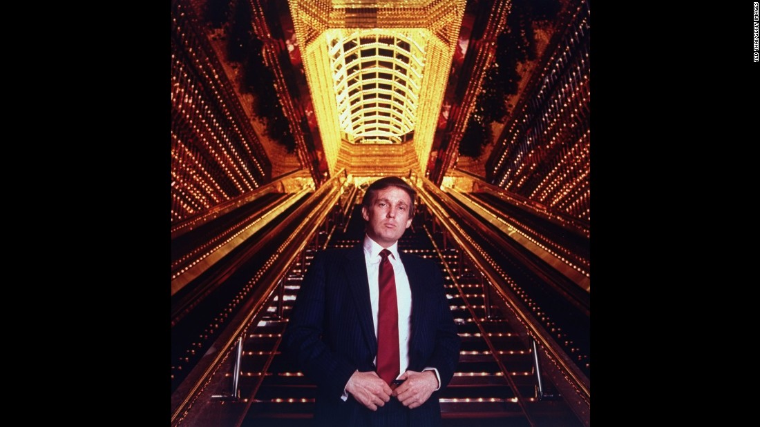 Trump stands in the atrium of the Trump Tower. 