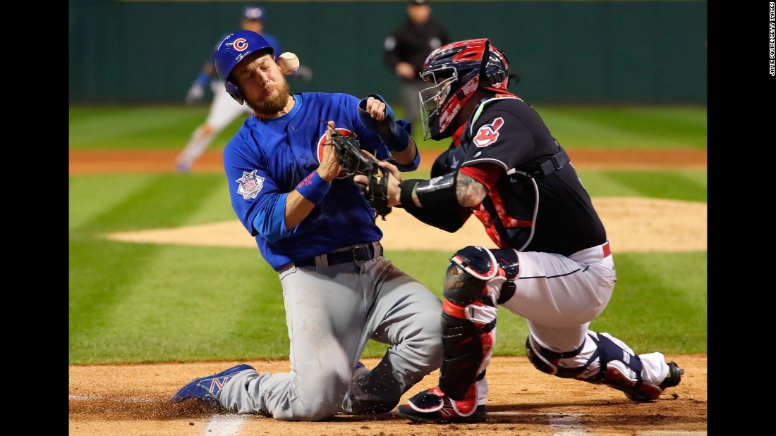 Ben Zobrist of the Cubs collides with the Indians&#39; Roberto Perez in the first inning of Game 6.