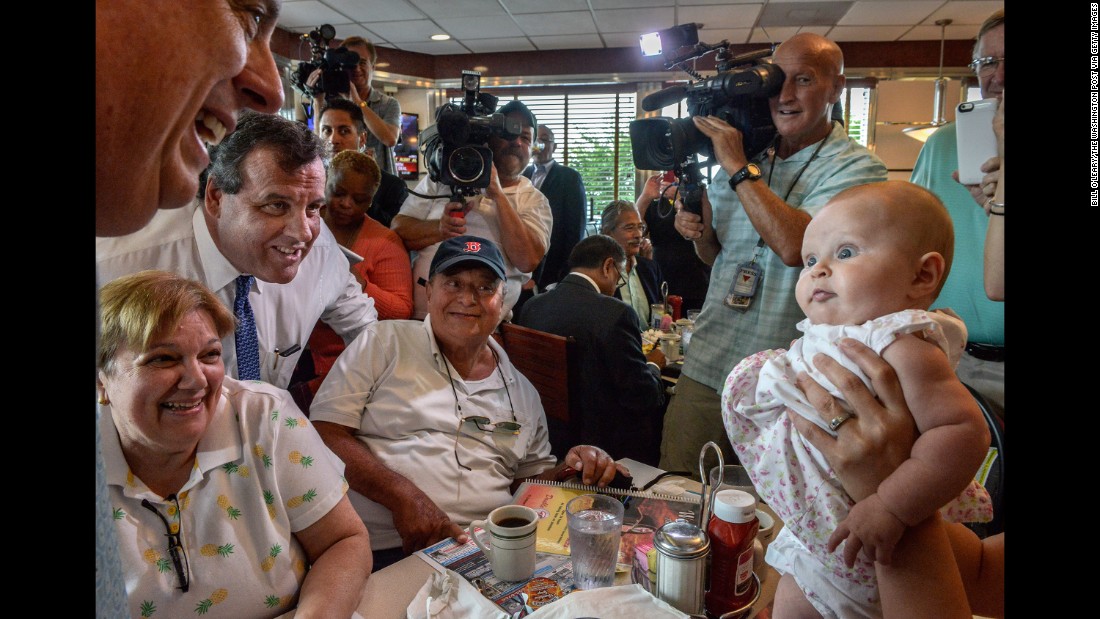 A baby looks at Maryland Gov. Larry Hogan at a diner in Annapolis, Maryland, on July 15, 2015. Hogan was there to endorse Republican presidential candidate Chris Christie, at left in the blue tie. Christie &lt;a href=&quot;http://www.cnn.com/2015/06/30/politics/chris-christie-2016-presidential-campaign/&quot; target=&quot;_blank&quot;&gt;joined the race&lt;/a&gt; with strong national name recognition and a record in public office that spans more than a decade, having served as New Jersey&#39;s governor since 2010 and a U.S. Attorney from 2002-2010.