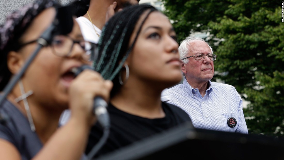 Seconds after Sanders took the stage for a rally in Seattle, a dozen protesters from the city&#39;s Black Lives Matter chapter &lt;a href=&quot;http://www.cnn.com/2015/08/08/politics/bernie-sanders-black-lives-matter-protesters/&quot; target=&quot;_blank&quot;&gt;jumped barricades and grabbed the microphone&lt;/a&gt; on August 8, 2015. Holding a banner that said &quot;Smash Racism,&quot; two of the protesters -- Marissa Johnson, left, and Mara Jacqueline Willaford -- addressed the crowd. Sanders stood just feet away off stage, chatting with his wife and the three aides that came to Seattle with him. His aides said the senator had no plans of leaving during the protests, but once Johnson did not appear willing to give up the mic after a moment of silence, organizers effectively shut down the event. Sanders never addressed the crowd, but he did make his way through it to shake hands and take pictures.