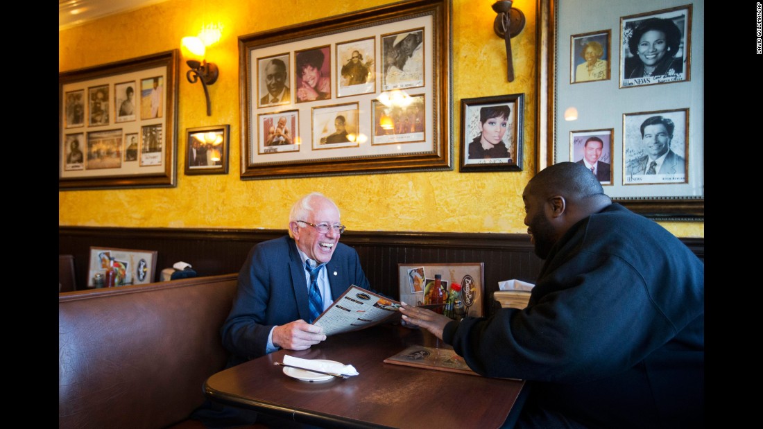 Sanders sits in an Atlanta cafe with rapper Killer Mike on November 23, 2015. The rapper introduced Sanders at a campaign event later that day.