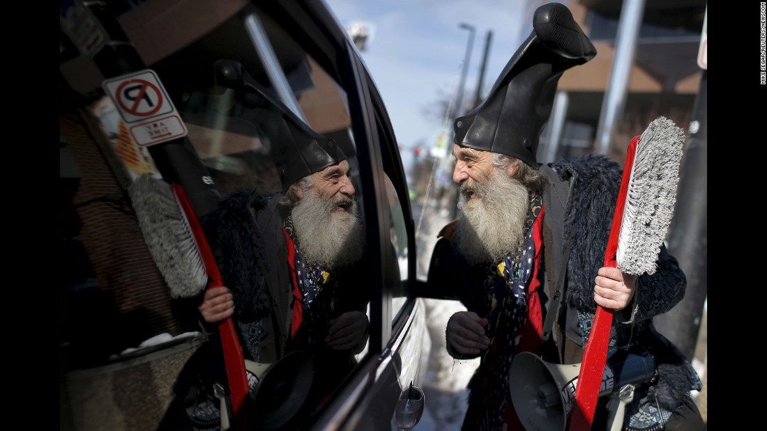 A performance artist named Vermin Supreme -- &lt;a href=&quot;http://www.cnn.com/2016/01/21/politics/new-hampshire-primary-lesser-known-candidate-debate/&quot; target=&quot;_blank&quot;&gt;who officially registered as a presidential candidate&lt;/a&gt; -- talks to a motorist as he campaigns in Manchester, New Hampshire, on February 6, 2016.