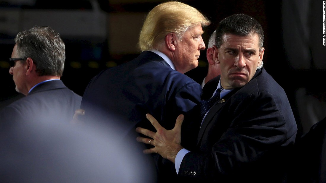 Secret Service agents surround Trump as he speaks at Dayton International Airport in Dayton, Ohio, on March 12, 2016. A man &lt;a href=&quot;http://www.cnn.com/2016/03/13/politics/thomas-dimassimo-donald-trump-protester-interview/&quot; target=&quot;_blank&quot;&gt;had tried to rush the stage.&lt;/a&gt;