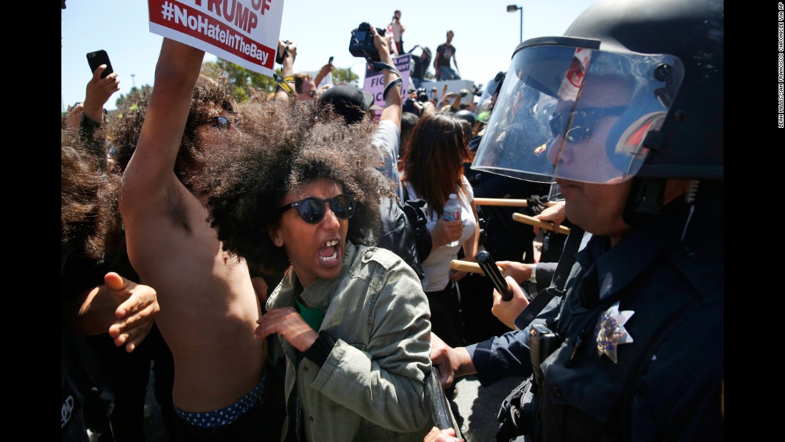 Protester Biseat Yawkal yells as she is pushed by police outside of the California Republican Convention on April 29, 2016. Trump protesters -- some of whom wore bandanas over their faces and carried Mexican flags -- &lt;a href=&quot;http://www.cnn.com/2016/04/29/politics/donald-trump-protests-republican-convention-california/&quot; target=&quot;_blank&quot;&gt;blocked off the road &lt;/a&gt;in front of the Hyatt Regency, forcing Trump&#39;s motorcade to pull over along a concrete median outside the hotel&#39;s back entrance. Trump and his entourage got out and walked into the building.