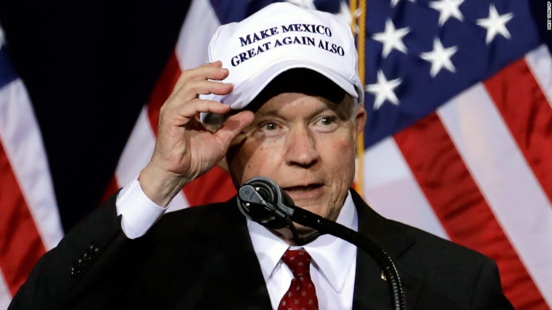 U.S. Sen. Jeff Sessions shows off his hat while he speaks during a Trump rally in Phoenix on August 31, 2016. &lt;a href=&quot;http://www.cnn.com/2016/09/01/politics/new-trump-hat-trnd/&quot; target=&quot;_blank&quot;&gt;The hat&lt;/a&gt; is related to Trump&#39;s campaign slogan, &quot;Make America Great Again,&quot; and its debut came hours after Trump traveled south of the border to meet Mexico&#39;s President.