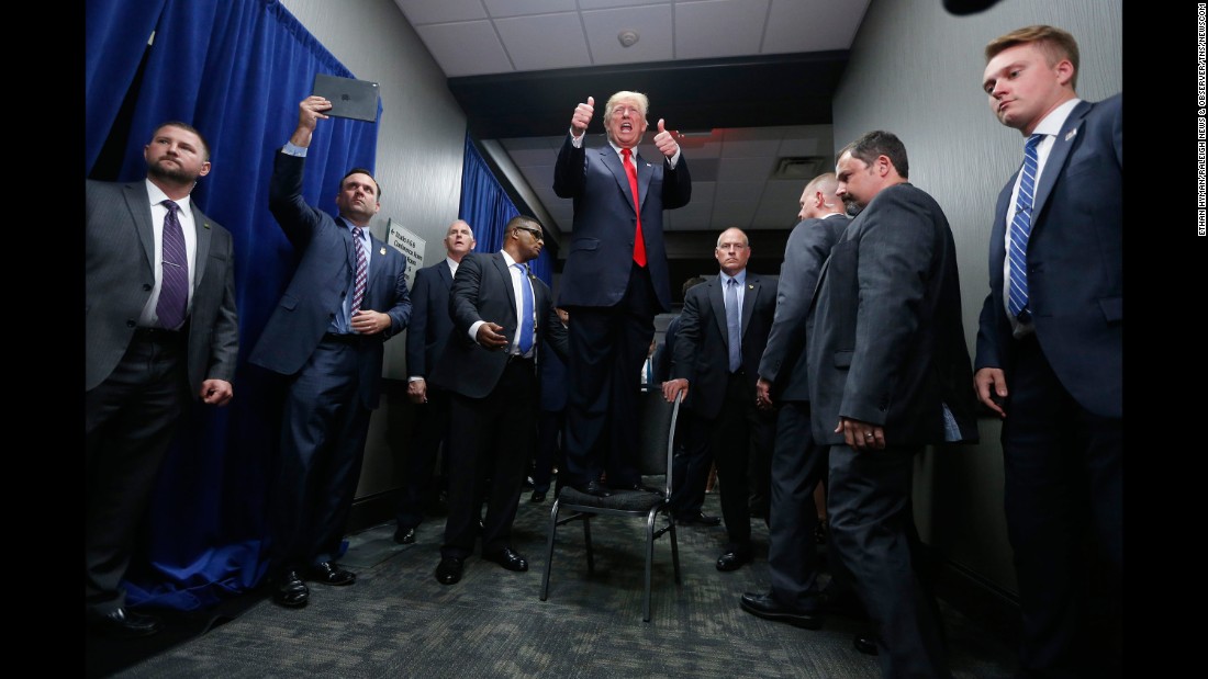 Trump gives a thumbs-up to supporters after speaking at a campaign rally in Greenville, North Carolina, on September 6, 2016.