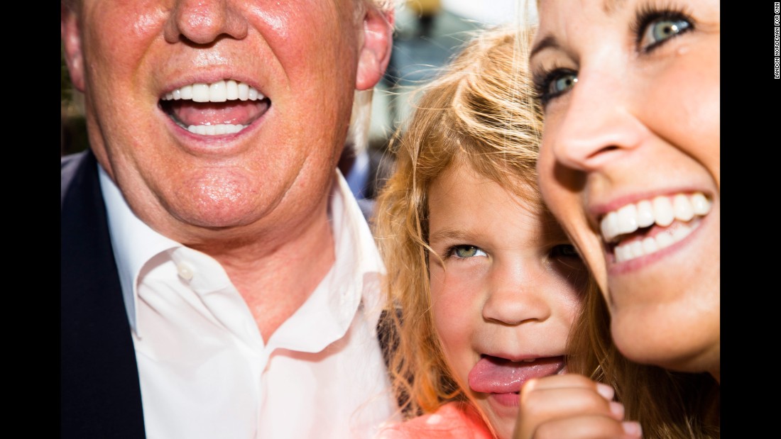 Trump poses for a picture with a woman and child at &lt;a href=&quot;http://www.cnn.com/2015/08/15/politics/gallery/iowa-state-fair-postcards/index.html&quot; target=&quot;_blank&quot;&gt;the Iowa State Fair&lt;/a&gt; on August 15, 2015.