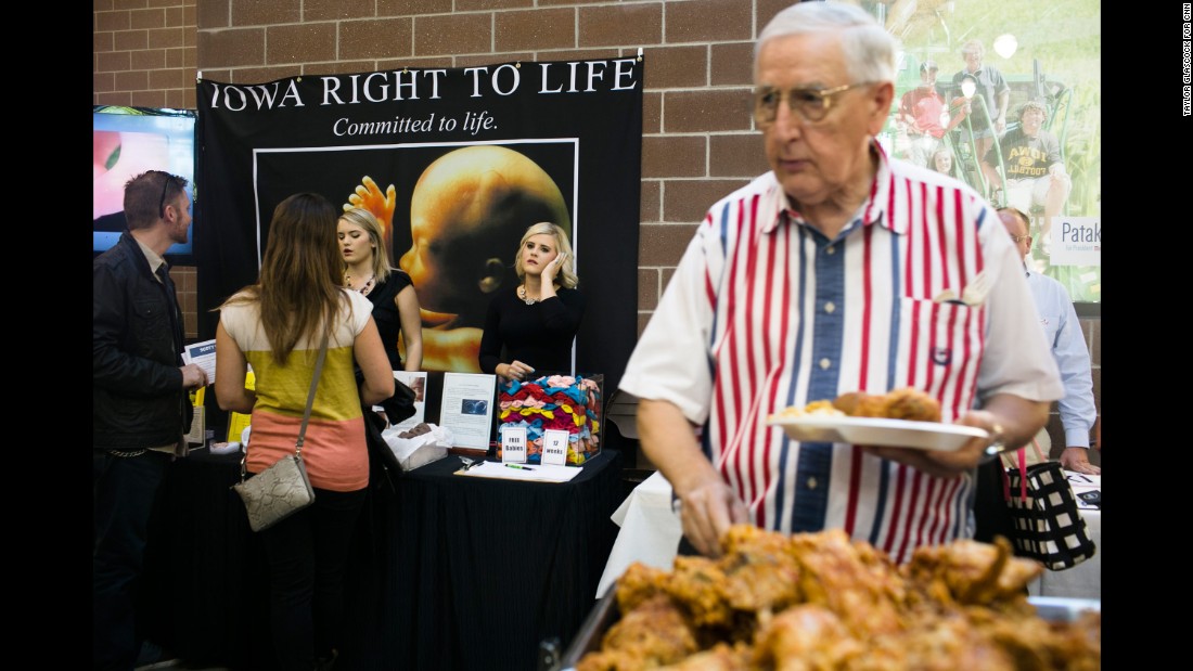 A man helps himself to a fried chicken buffet near an anti-abortion display at the Iowa Faith &amp;amp; Freedom Coalition&#39;s&lt;a href=&quot;http://www.cnn.com/interactive/2015/10/politics/fear-voting-christian-right/&quot; target=&quot;_blank&quot;&gt; Fall Family Dinner&lt;/a&gt; in September 2015. Defunding Planned Parenthood was a popular topic during the forum. 