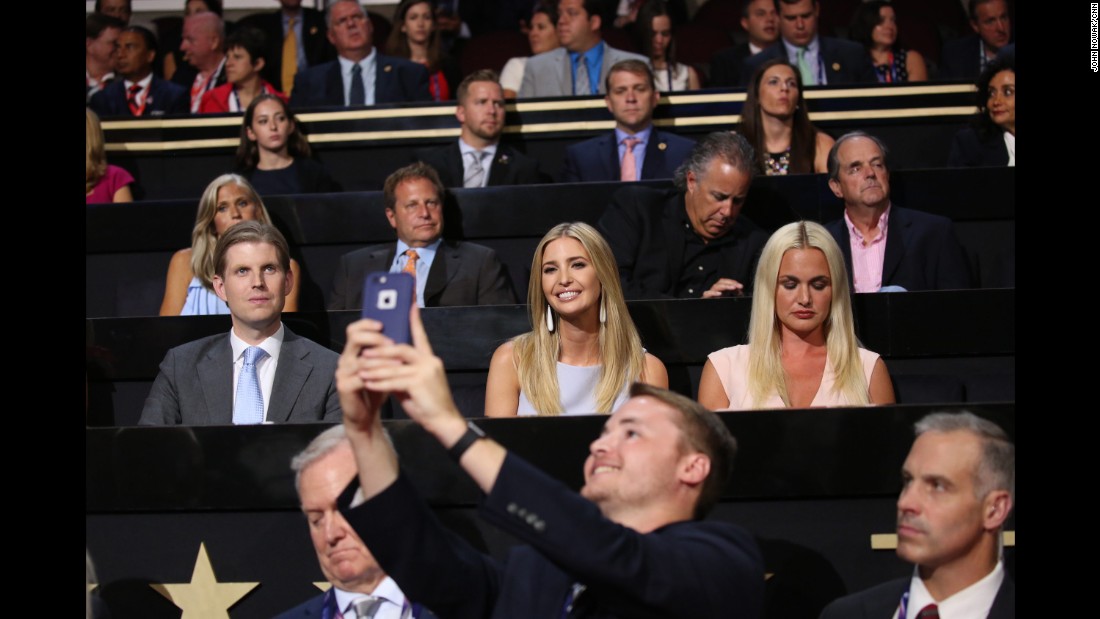 Trump&#39;s daughter Ivanka smiles for a man&#39;s photo at the convention.