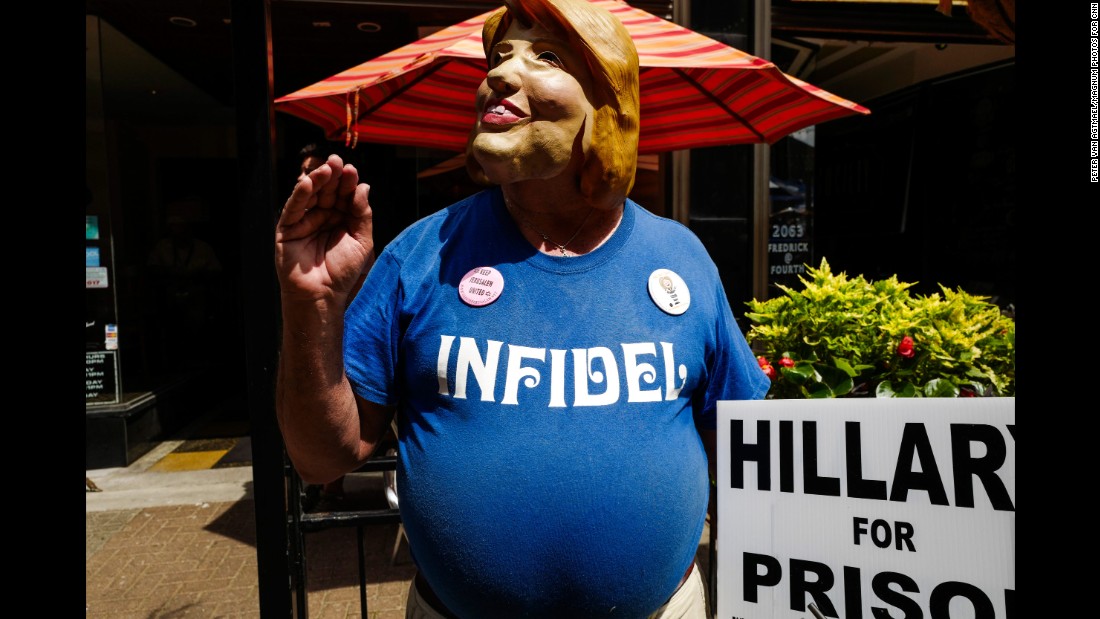 A protester wears a Hillary Clinton mask &lt;a href=&quot;http://www.cnn.com/2016/07/20/politics/gallery/outside-rnc-van-agtmael/index.html&quot; target=&quot;_blank&quot;&gt;outside the Republican National Convention.&lt;/a&gt; CNN sent photographer Peter van Agtmael into the crowds of both conventions to get a handle on what it&#39;s like away from the politicians and delegates.