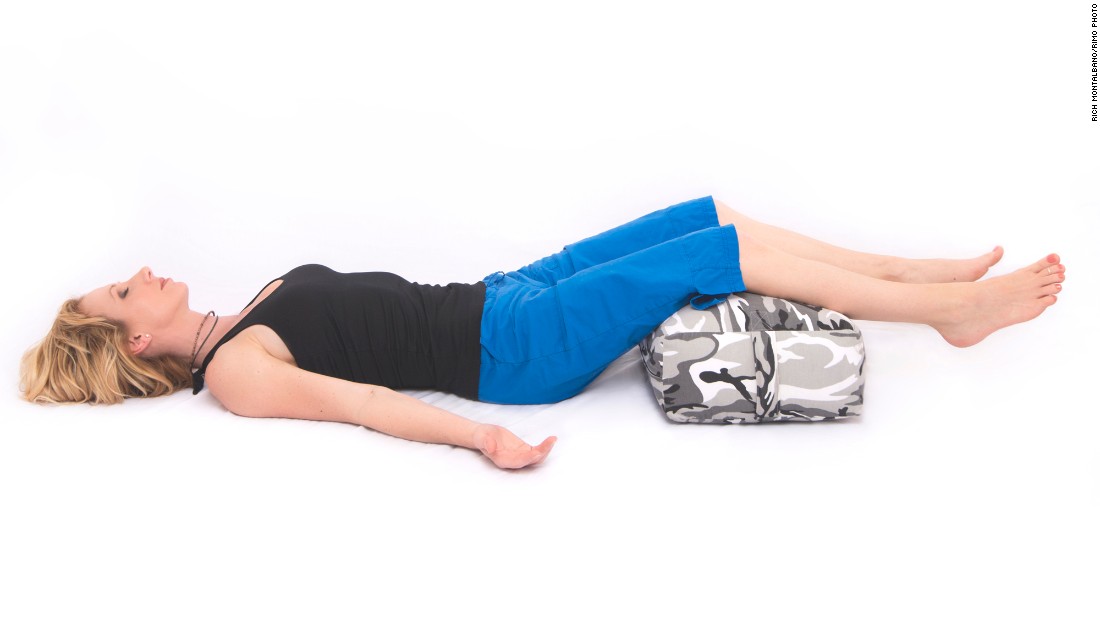 Lie down comfortably with a bolster or pillow under your legs and set a timer for a desired length of time; eight to 10 minutes is a good starting point. Close your eyes. Notice your breathing and the sense of release and comfort in your legs as they rest on the bolster. Remain committed to simply being in your body in your relaxed posture.