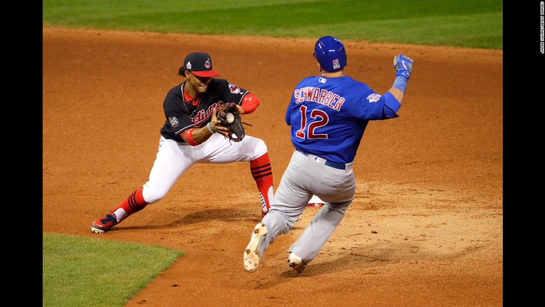 Francisco Lindor of the Indians tags out Kyle Schwarber of the Cubs during the third inning of Game 7.