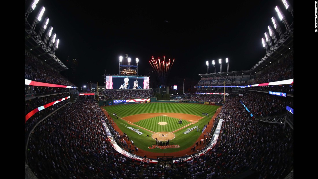 The Cleveland Indians and Chicago Cubs stand for the national anthem prior to Game 7.
