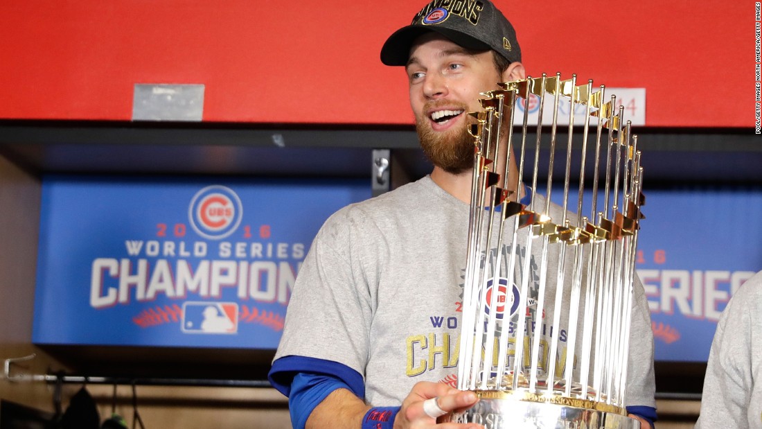 World Series MVP Ben Zobrist of the Cubs poses with The Commissioner&#39;s Trophy.