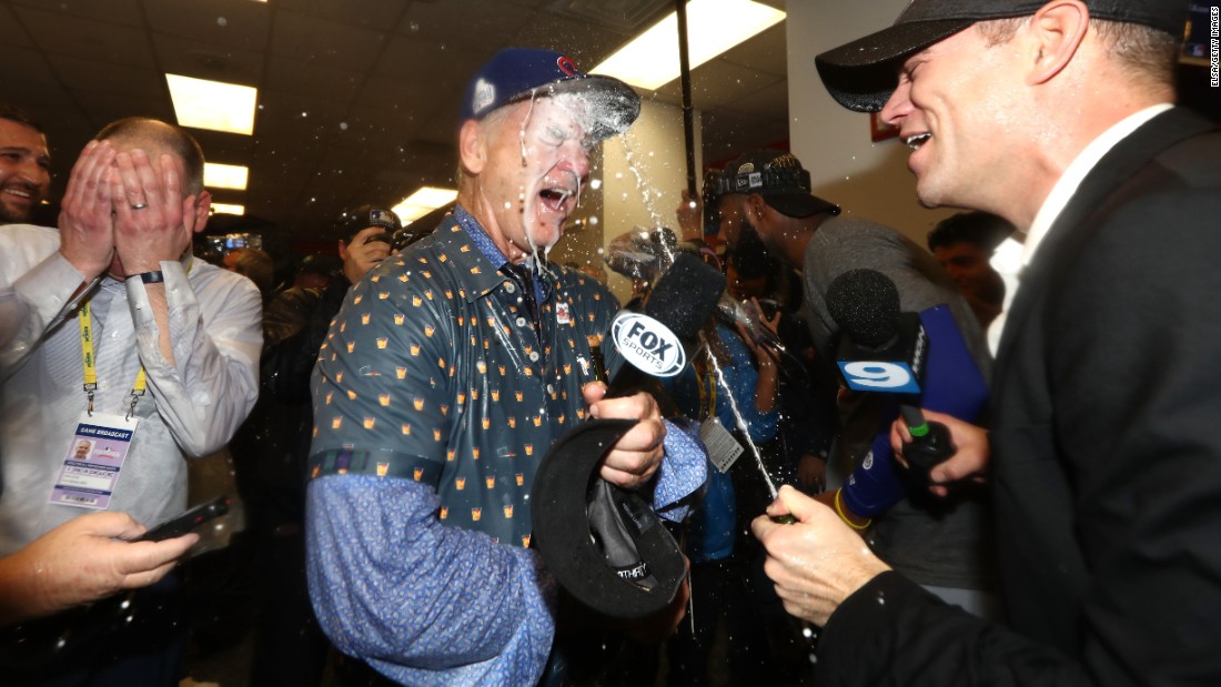 Actor Bill Murray, a longtime Cubs fan, celebrates in the winning clubhouse with Theo Epstein, the team&#39;s president of baseball operations.