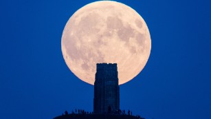 A supermoon rises behind Glastonbury Tor in September  2015 in Glastonbury, England.