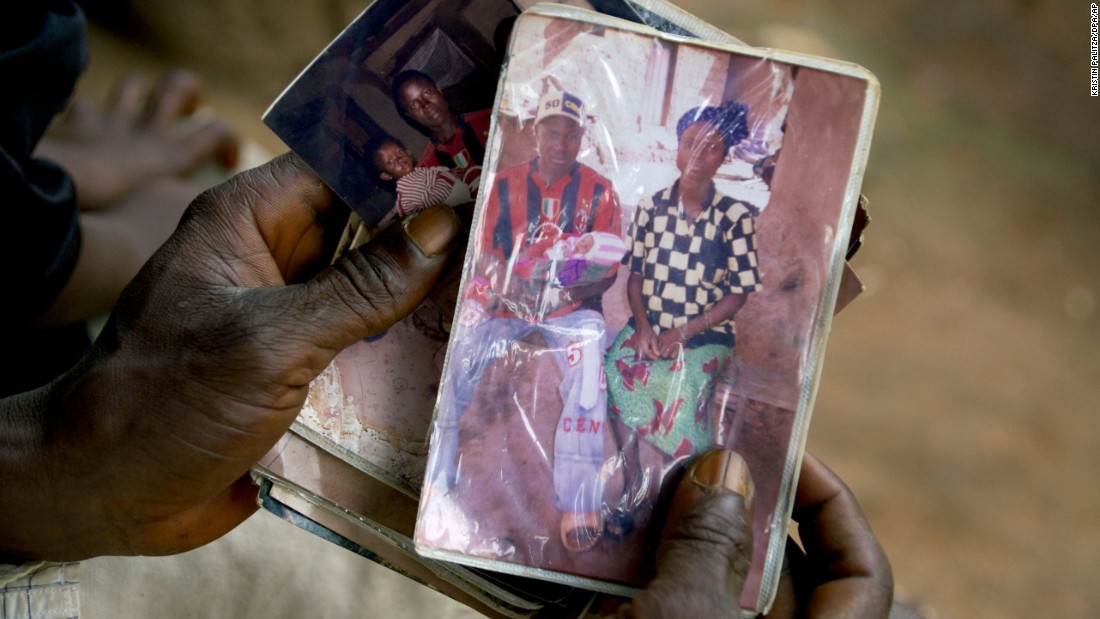 Emile Ouamouno, a 2-year-old boy in the southern Guinea village of Meliandou, was identified as &quot;patient zero&quot; in the Ebola outbreak circa 2014. Emile died of the disease, as did several of his family members. Emile&#39;s father, Etienne Ouamouno, holds a picture of his second wife, Sia Dembadouno, and Emile.