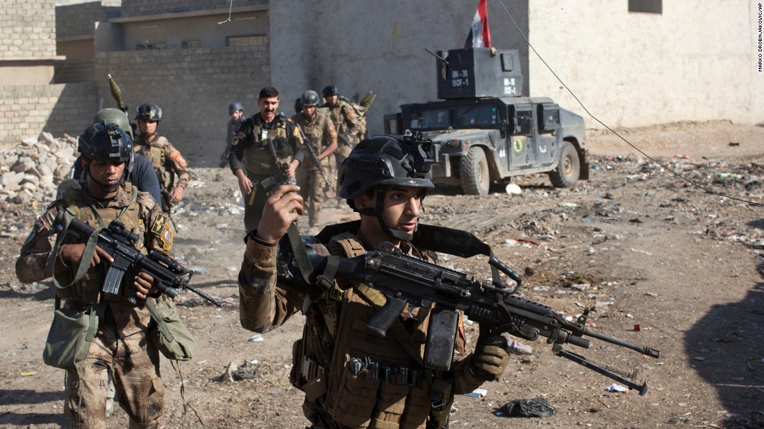 Iraqi soldiers patrol an alley on the outskirts of Mosul on Friday, November 4.