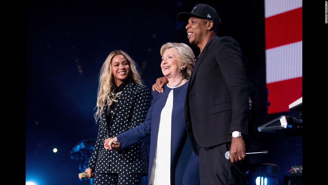 Clinton joins Beyonce and Jay Z on stage during a free concert in Cleveland on November 4.