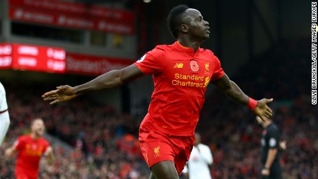 Sadio Mane of Liverpool celebrates scoring the opener against Watford as his team goes top of the English Premier League.