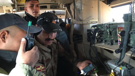 For more than 28 hours, CNN senior international correspondent Arwa Damon and photojournalist Brice Laine were with Iraqi special forces during their push into ISIS-held Mosul. Their convoy was leading the operation Friday when it came under attack multiple times. Here, on Friday at 9 a.m., soldiers make a frantic radio call: &quot;Yellow car to the right.&quot;