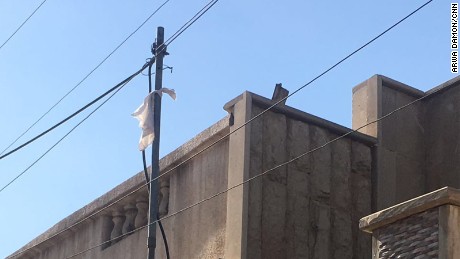 A white rag was hung outside a home next to where Arwa and her team are stationed.