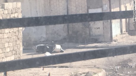 A motorcycle lays abandoned on the ground. The driver jumped from it while it was still moving and ran away. 